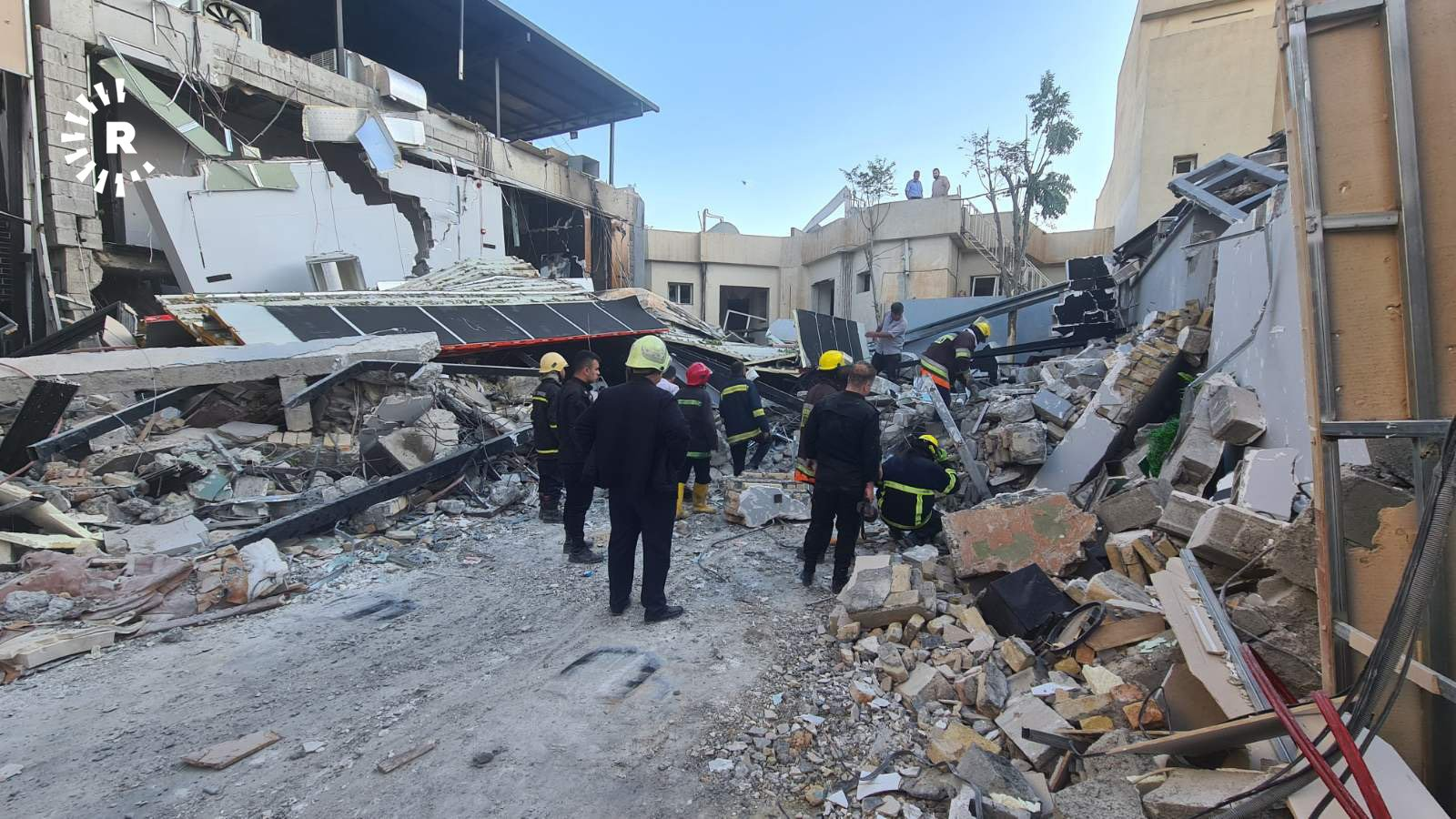 Civil defense teams inspecting the site of a gas explosion in Sulaimani on May 12, 2022. Photo: Mariwan Ali/Rudaw